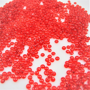 Dekosteine-Tautropfen rot glänzend ca.Ø 4mm x 5mm pro Tropfen ca.3000 Tropfen. Als Streudeko oder Bastelgranulat
